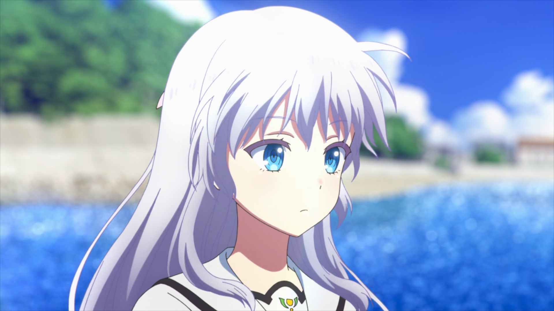 A white haired, blue eyed girl staring emotionlessly at nothing.